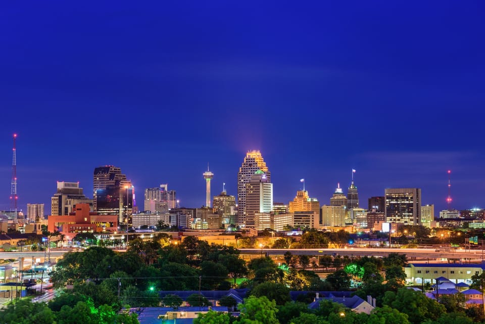 San Antonio city lights glowing at dusk, viewed from the Westover Hills area