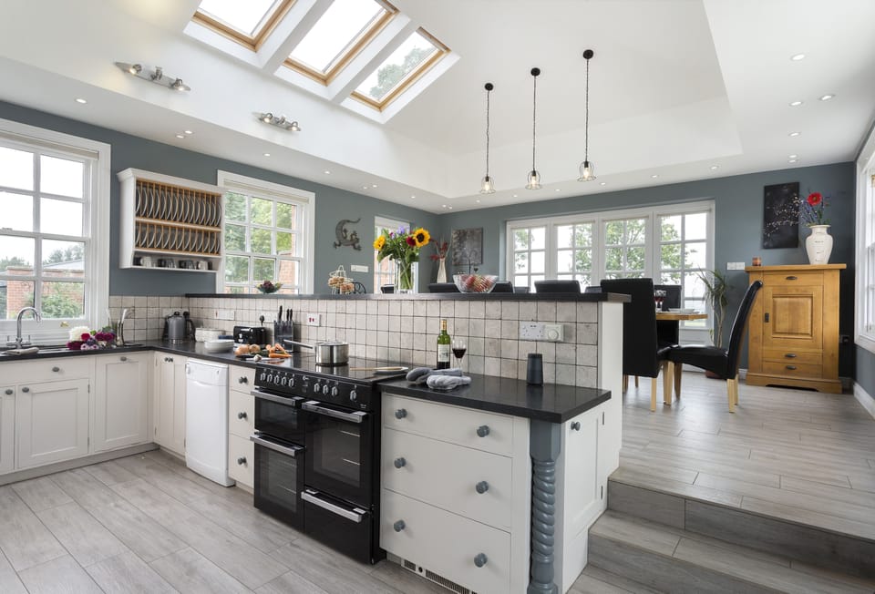 Ground floor: Fully equipped kitchen and dining room with french doors that lead out into the garden