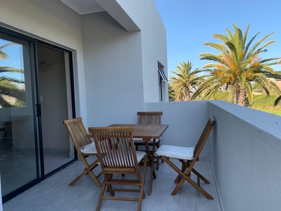 Balcony with table and chairs