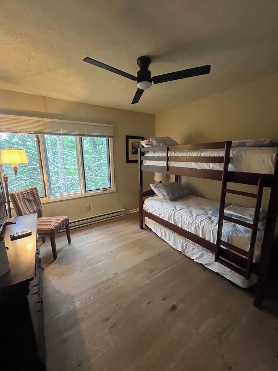 Twin bunk beds with a trundle bed to accommodate three guests 