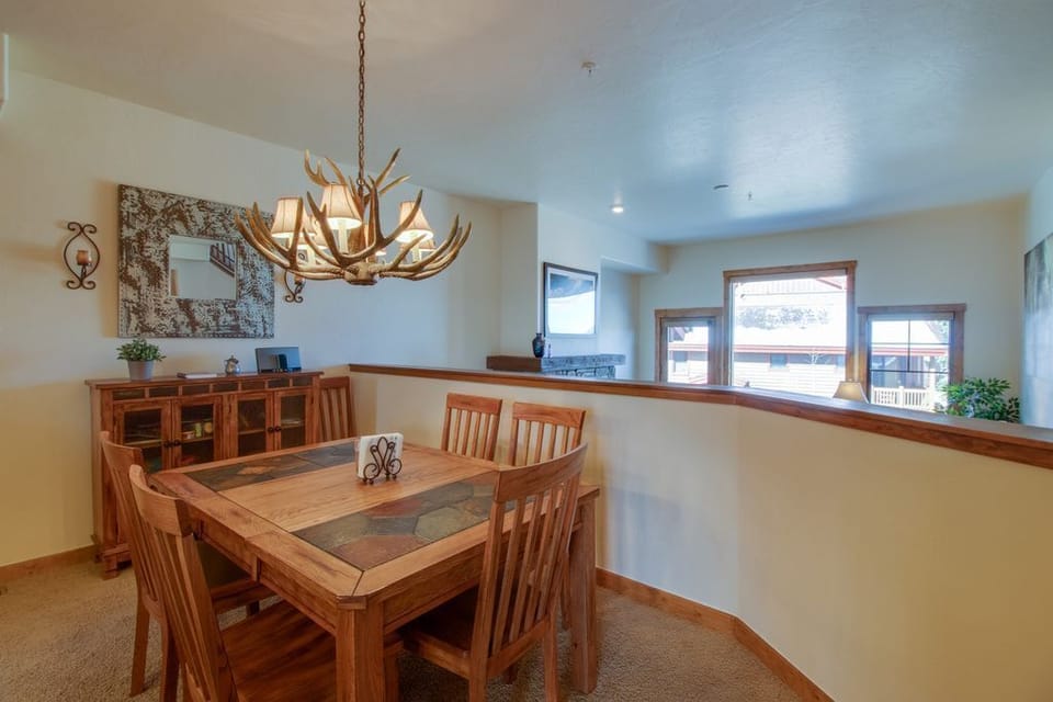 Gather around this warm dining space where rustic charm meets modern comfort, perfect for memorable meals together.