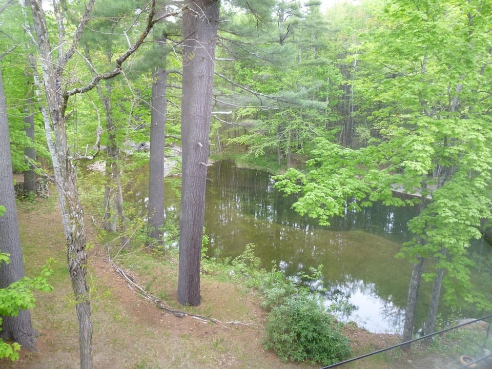 VIEW NORTH UP THE POOL AND KEARSARGE BROOK FROM MASTER BEDROOM. 