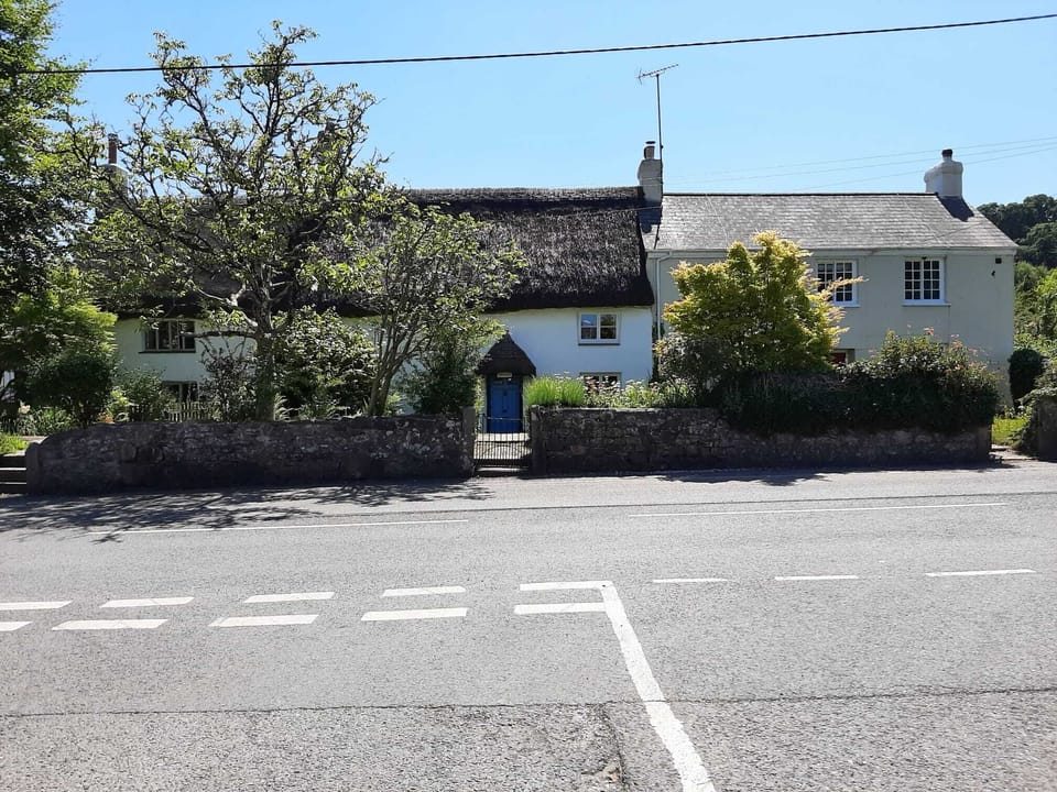 House sitting snugly in the terrace taken from the T junction of Oak Tree Park 