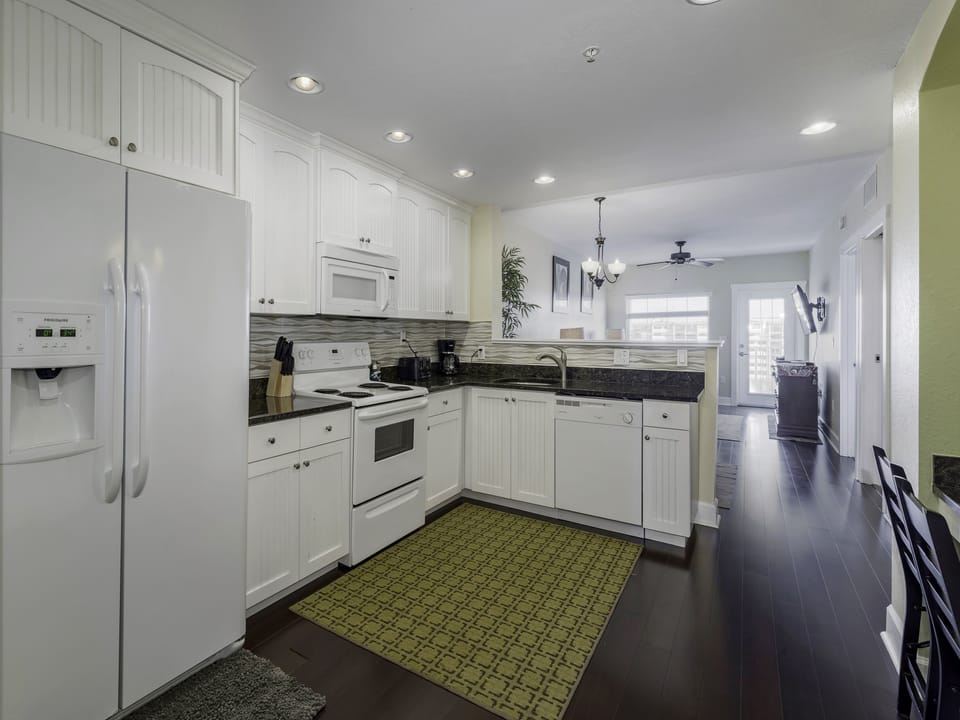 The Kitchen is stocked with cookware, fridge, microwave, dishwasher and Mr. Coffee