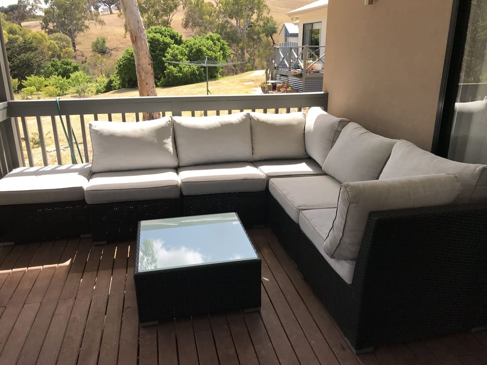 Comfortable outdoor setting and BBQ on the covered verandah
