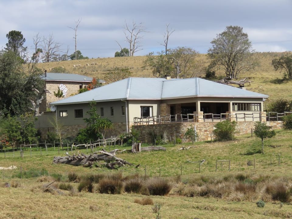 House and lodge behind