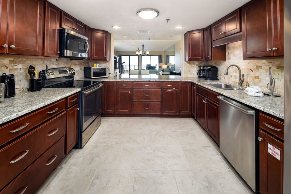 Kitchen - Classy appliances, granite counters, custom cabinets are awaiting the cook! The chef of the group will love this setup!