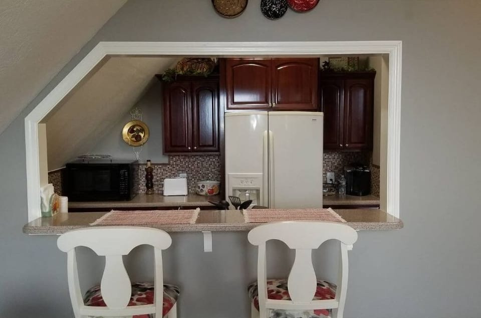 Bar height eating as well as having a dining table