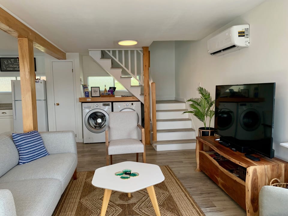 Stairs Up To The Second Story. Full Size Washer And Dryer.