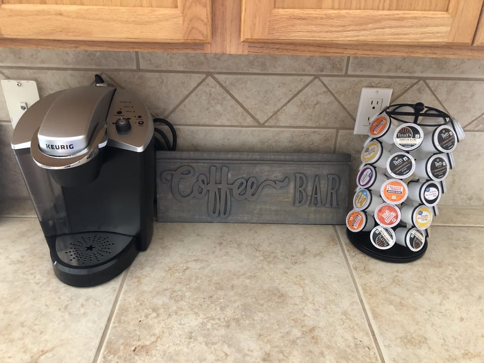 Keurig coffee maker with fully stocked coffees for guests. 