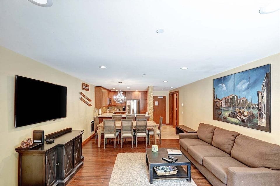 Spacious living room with large smart TV