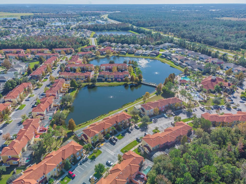 Discover the charm of this inviting community, where terracotta rooftops blend with lush greenery by a tranquil lake. Stroll leisurely along the water's edge or unwind on your patio, savoring the stunning views.