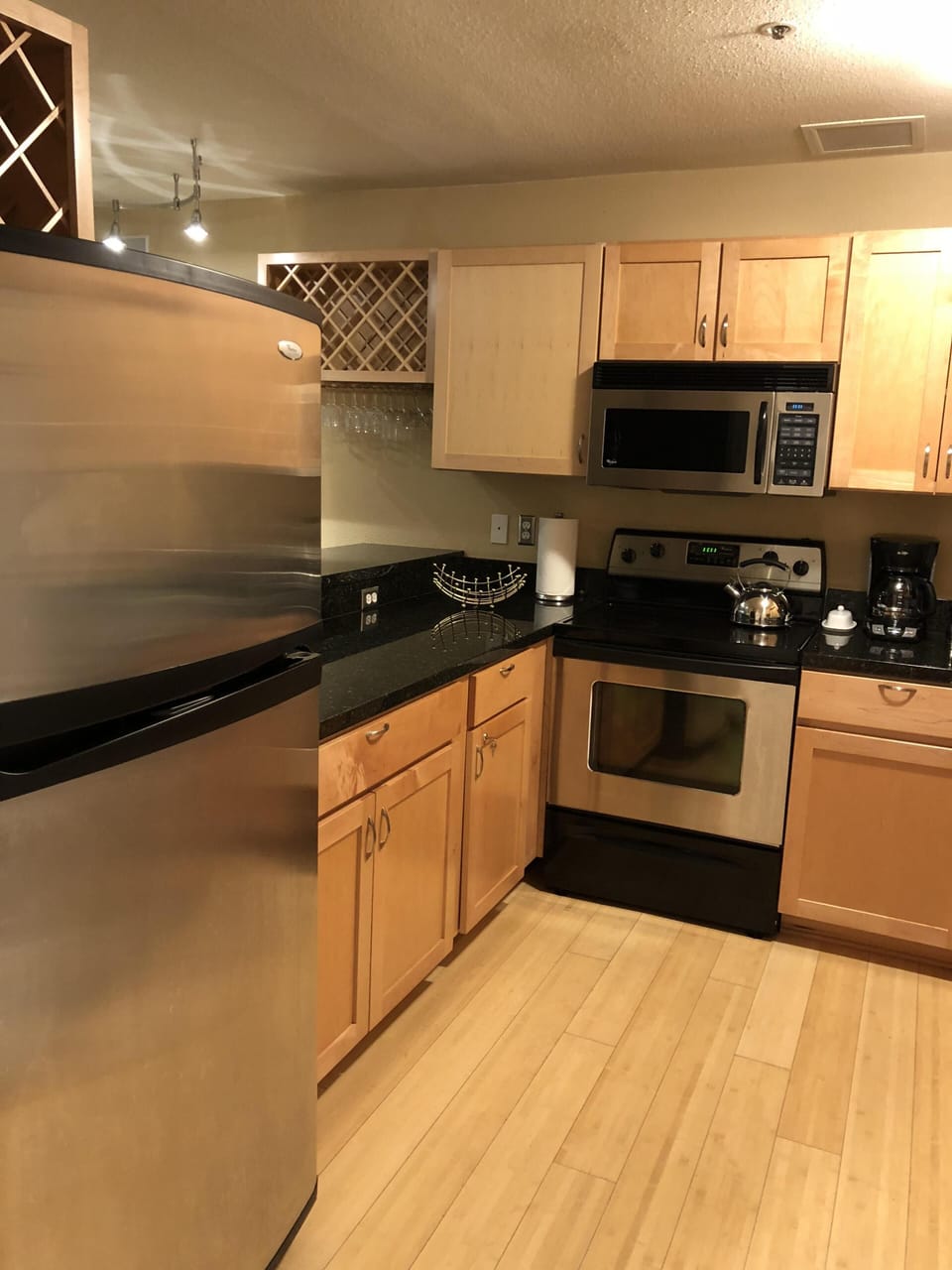 Large fully stocked kitchen wit recently updated Stainless Steel appliances.