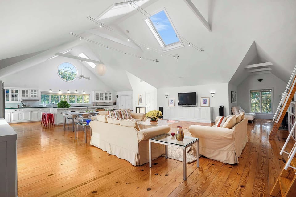 Comfortable living area with loft access