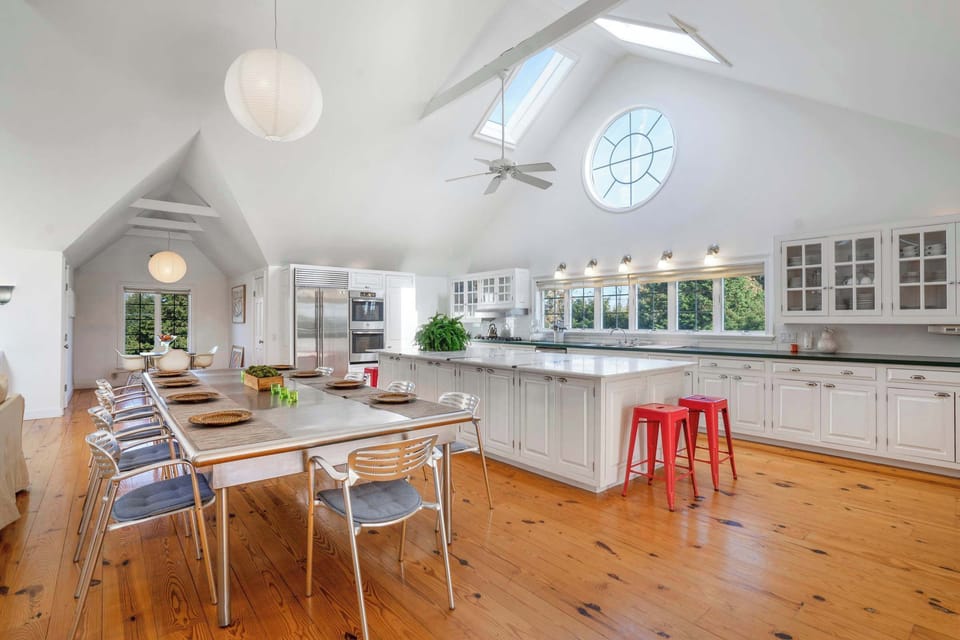 Chef's kitchen with island seating and dining for 8