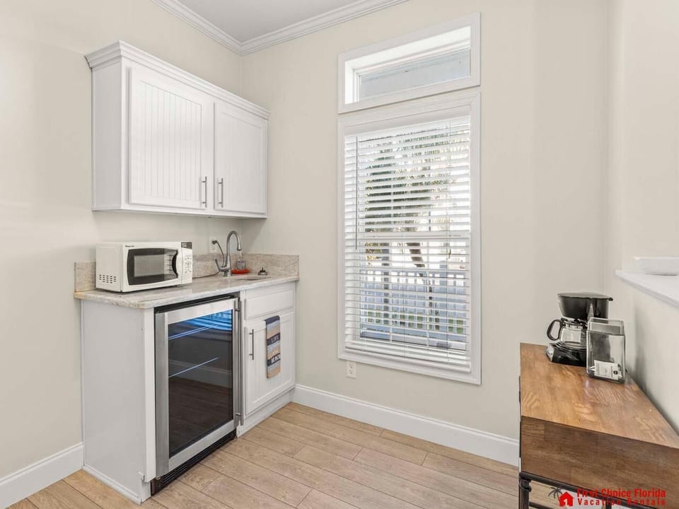 Bright kitchenette with modern appliances and natural light