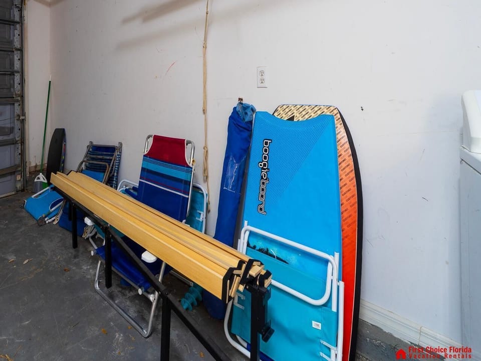 Organized storage area with beach gear and surfboards ready for adventure