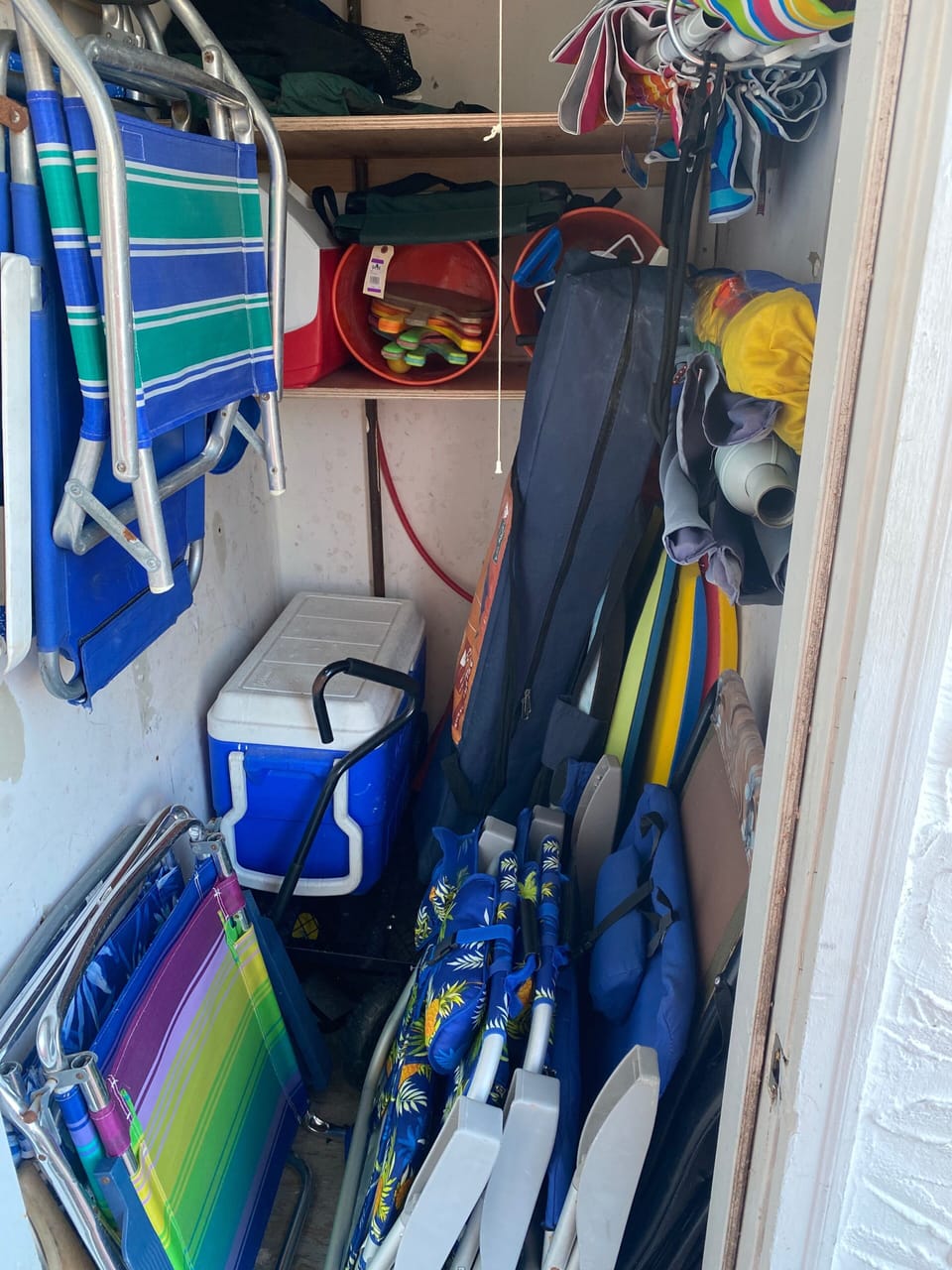 Closet full of beach gear- chairs, umbrellas, cooler, boogie boards, etc! 