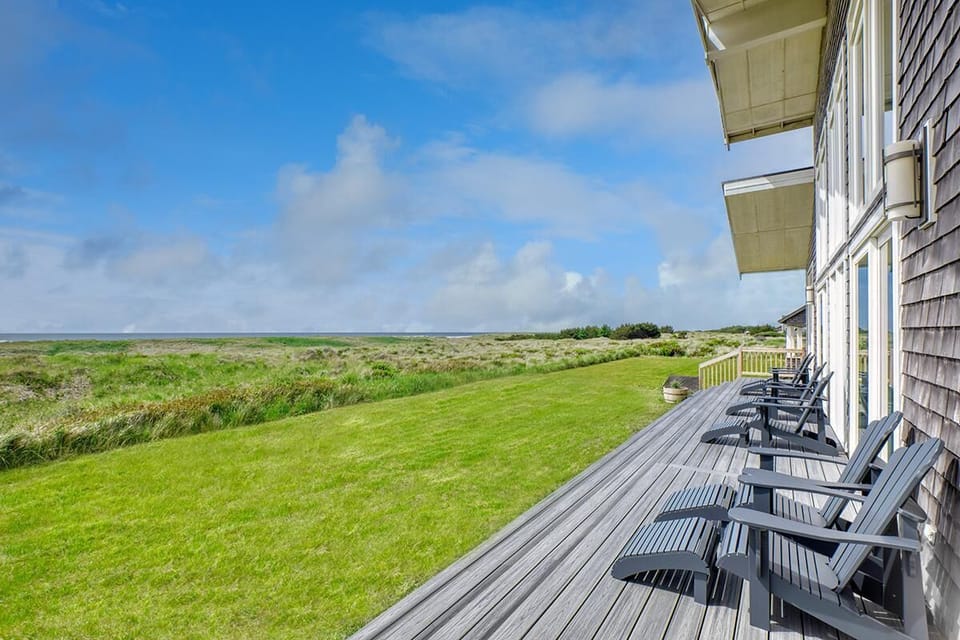 Brand new front deck with stunning ocean views and 6 Adirondack chairs.