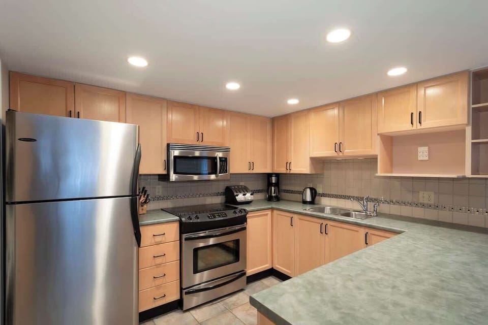 - Fully equipped kitchen with stainless steel appliances  
- Ample counter space for cooking your favorite meals  
- Modern Whistler townhouse with everything for your stay  