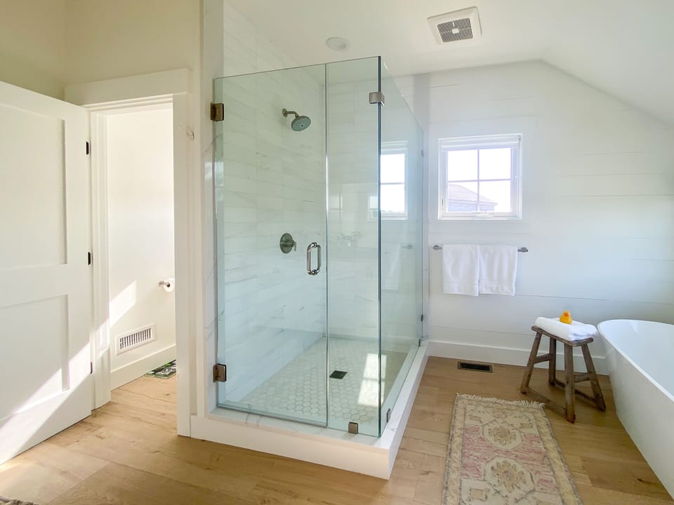 Master bath with private commode and soaking tub. 