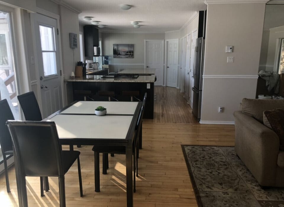 Beautiful open concept eating area, large kitchen with view of backyard and lake