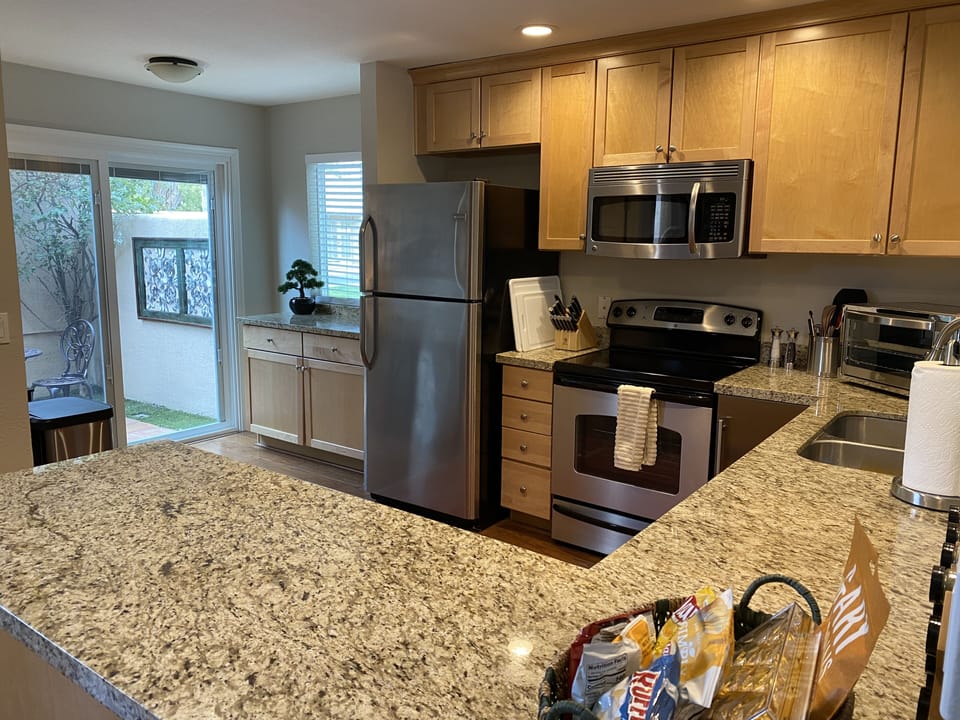 Full kitchen with stainless steel appliances