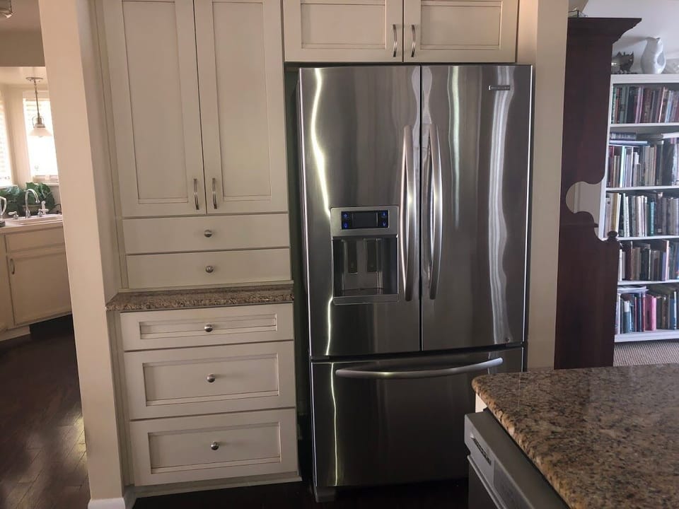 Stainless refrigerator with water and ice in the door