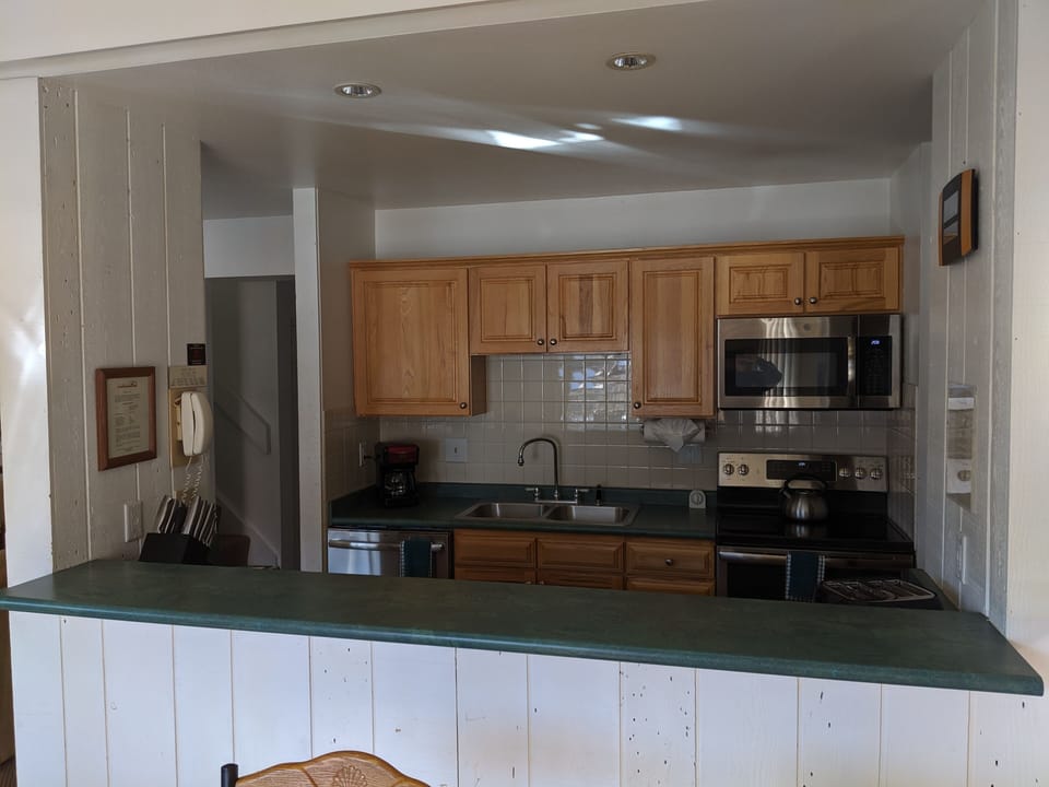 Kitchen opens to dining area