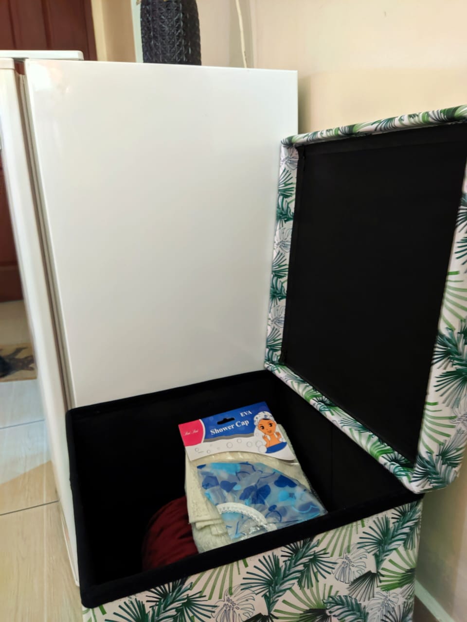 We have a fold ottoman for essentials like towels, shower caps and bed sheets.