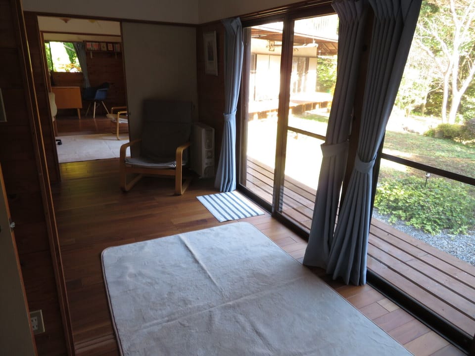 Three of the guest room spaces with view to garden.
