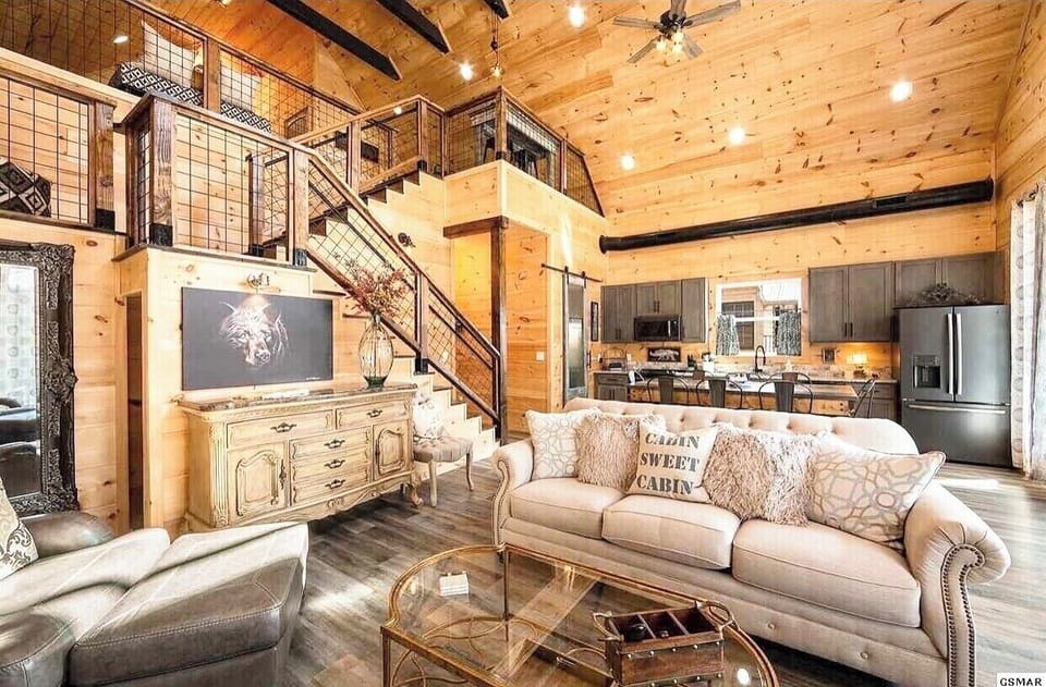 comfortable living room and well stocked kitchen with views of the river