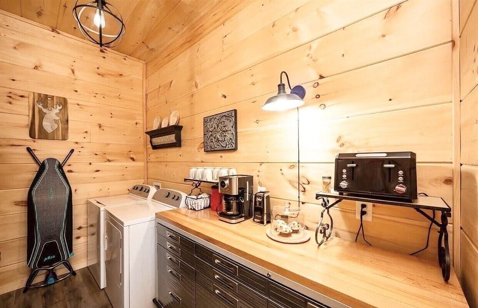 Laundry room and pantry equipped with toaster, coffee pot and cookware