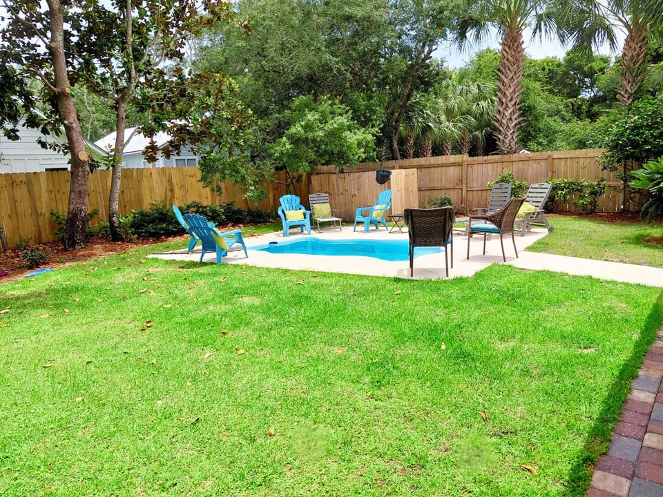 Relaxing fenced outdoor setting for gatherings with Pool, Tiki Bar & Grill!