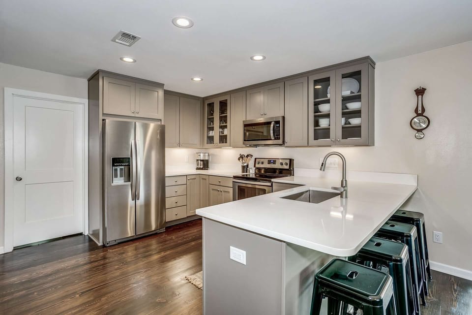 Quartz countertops and new cabinets in the fully equipped kitchen