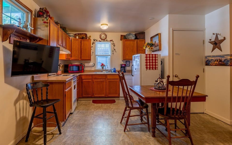 The well equipped kitchen with eat in dining is comfortable and convenient.