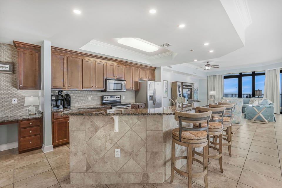 Modern, completely stocked kitchen with any desire a chef could have to do meals