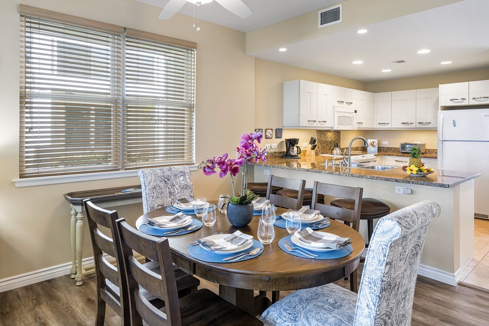 Dining table next to kitchen