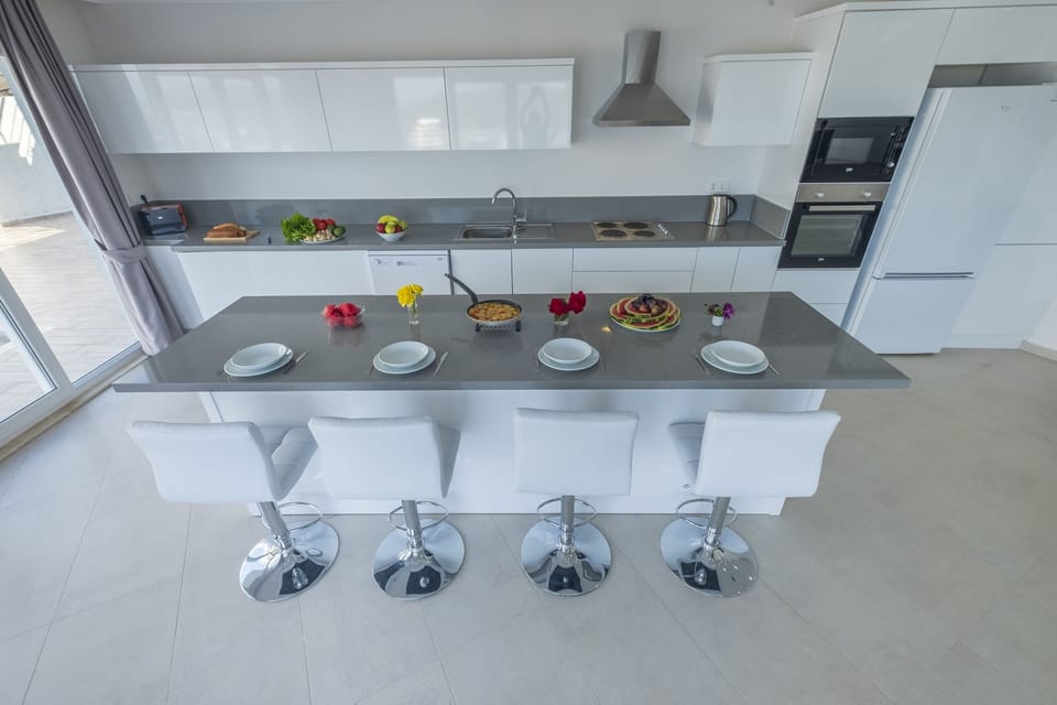 Kitchen with island and seating.