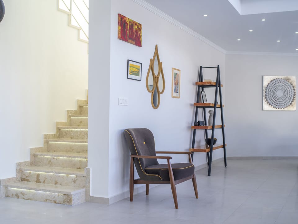 Staircase leading to the main entrance and bedrooms.