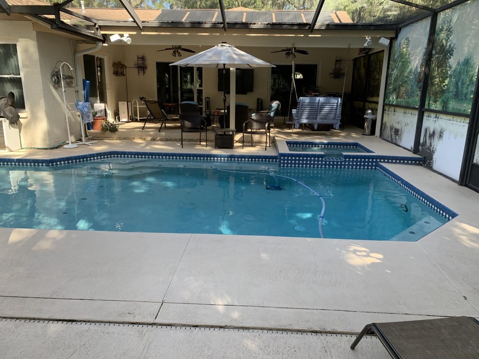Caged lanai, bar, pool, spa and BBQ
