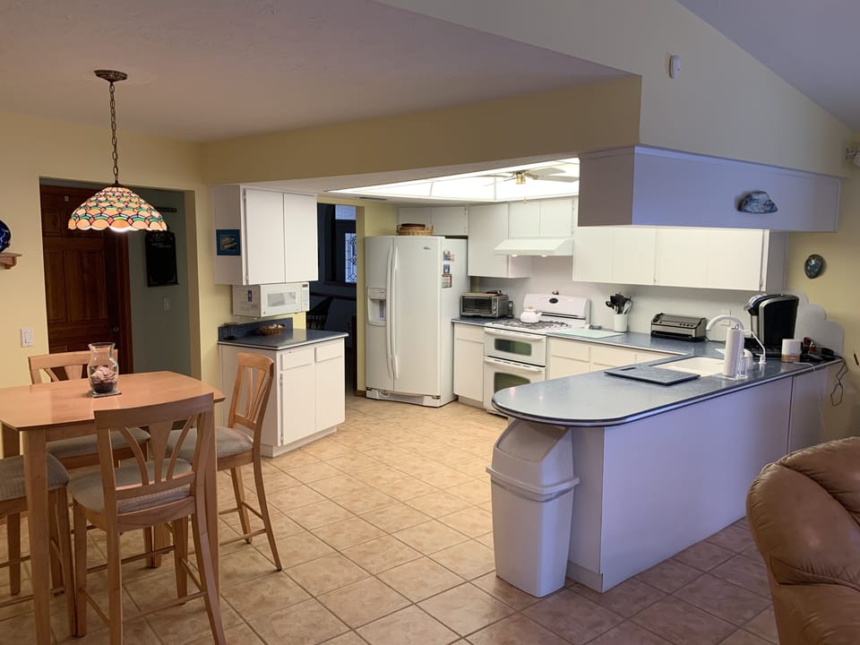 Large, brightly lit full kitchen