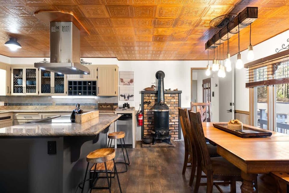 Open kitchen with dining and bar seating