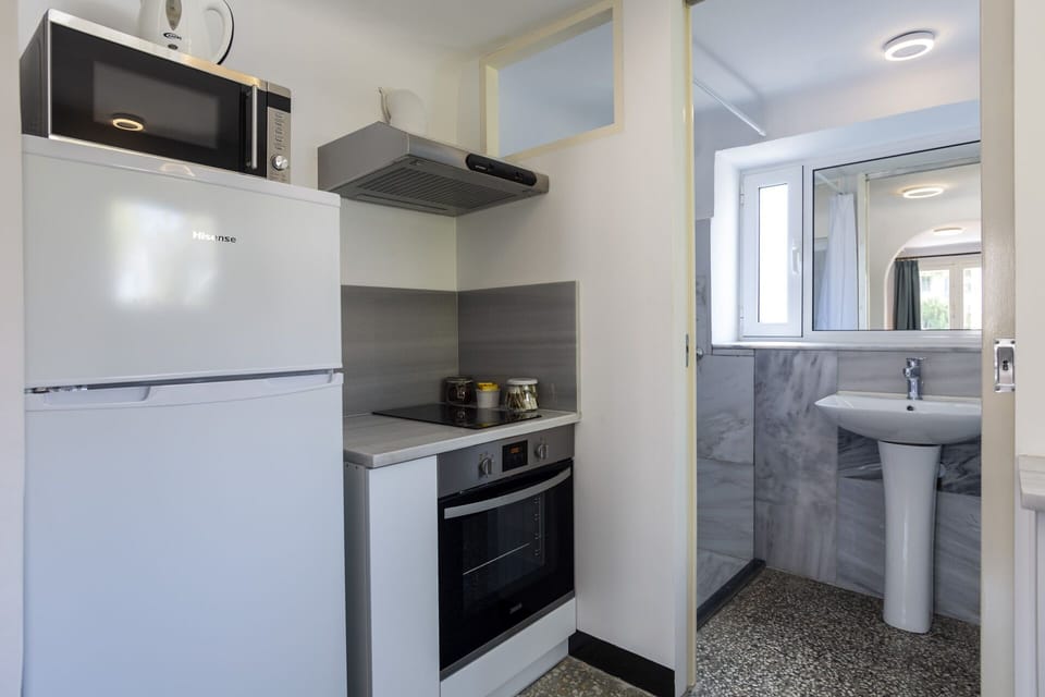 Kitchen and bathroom in the background