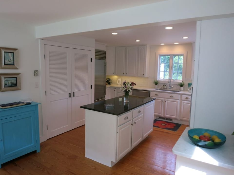 Kitchen with washer/dryer behind doors