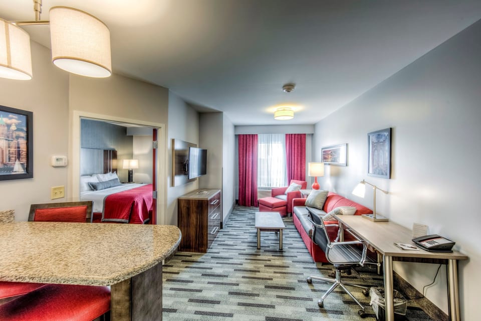 Relax in the living area featuring a flat screen TV and sleeper sofa