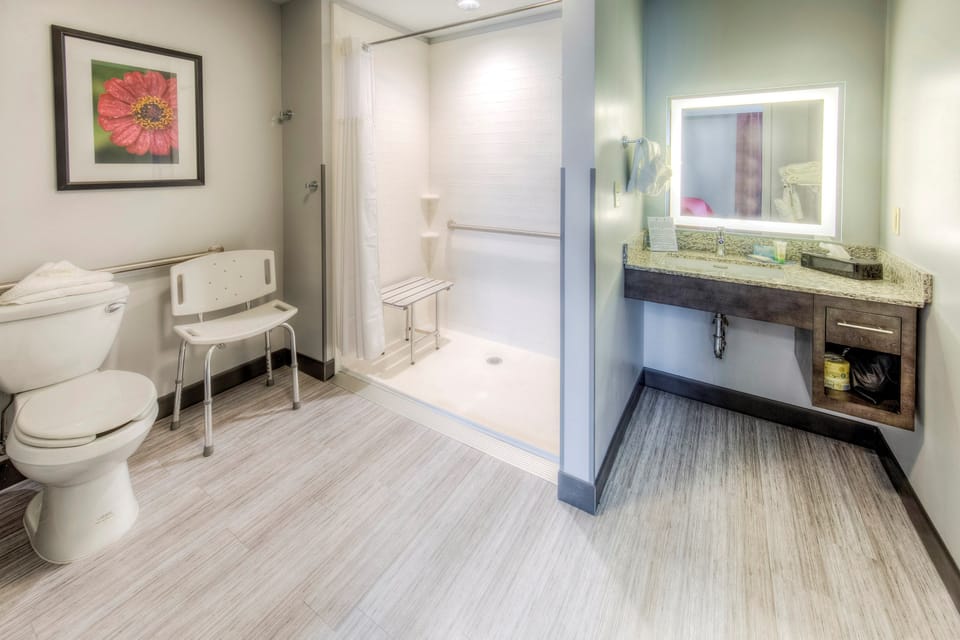 Get ready for the day in the modern and bright accessible bathroom.