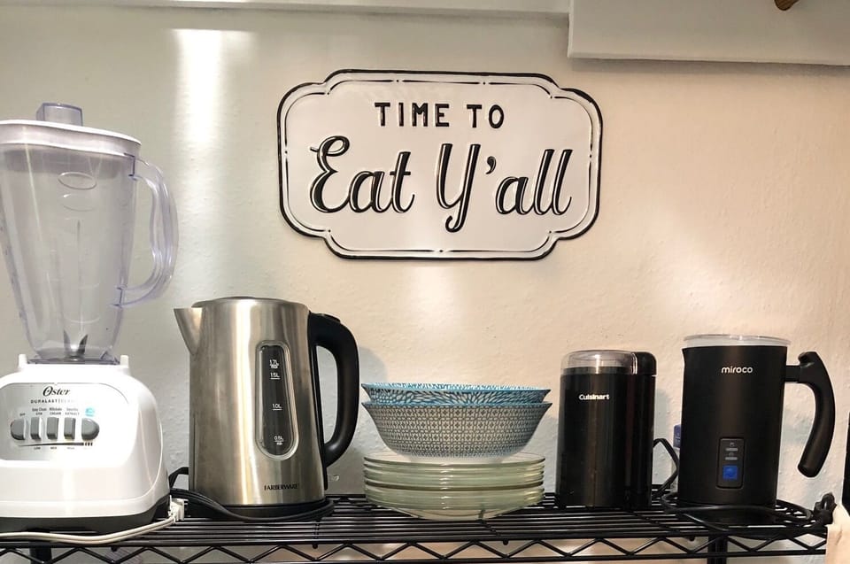 Blender, hot water warmer, coffee grinder, milk steamer, serving dishes.