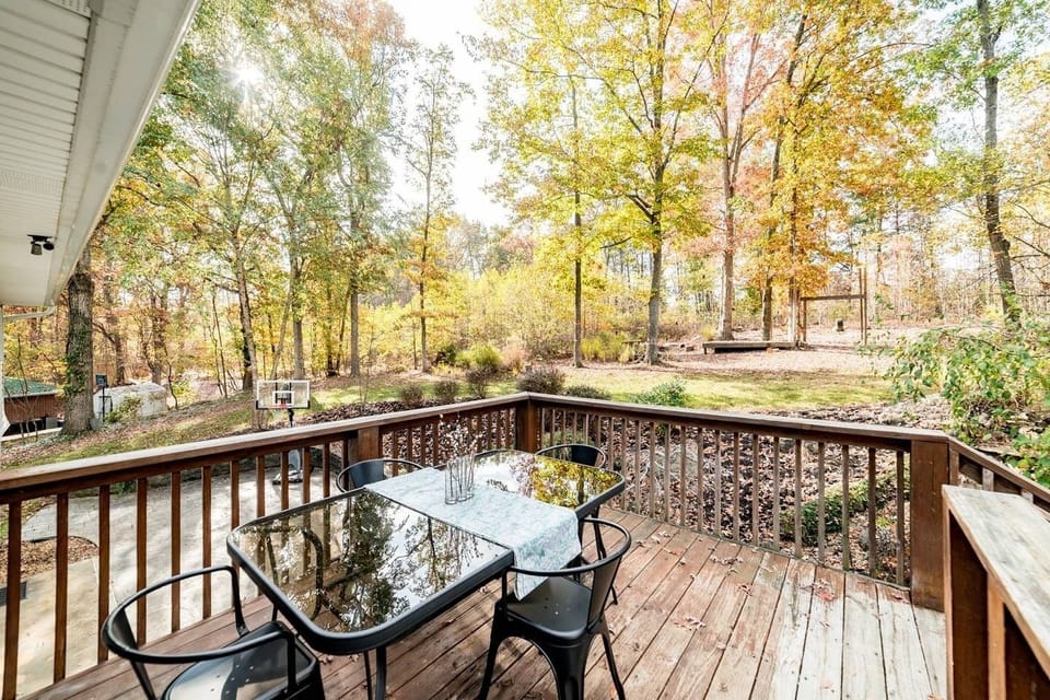 Back deck overlooks patio and back yard