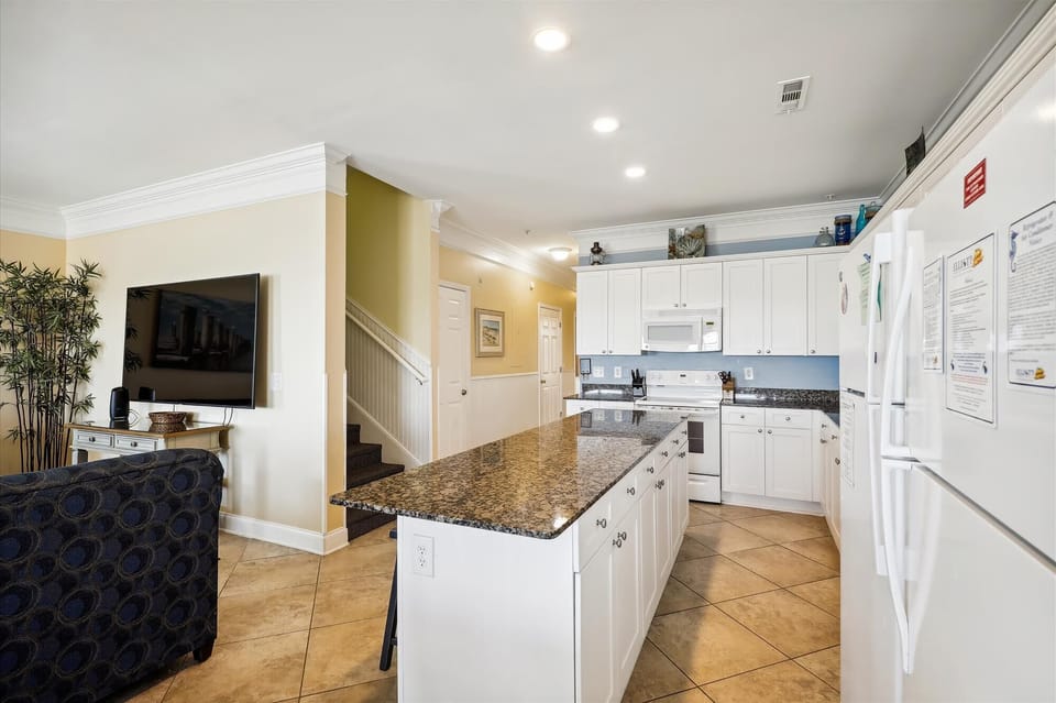 The open floor plan allows the family chef to be included in all the fun!